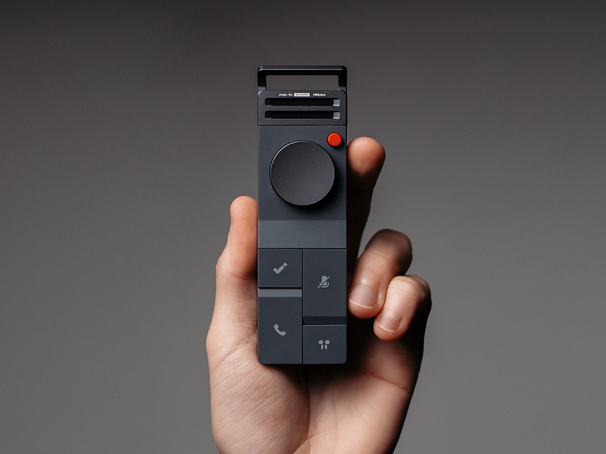 HiDock recorder held in hand, recording a meeting